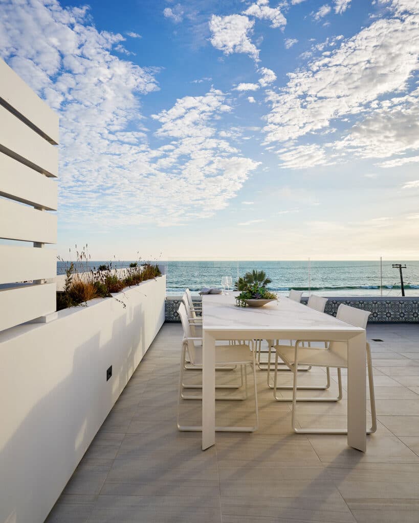 Outdoor dining area at a beautiful beach home built by RJ Smith Construction