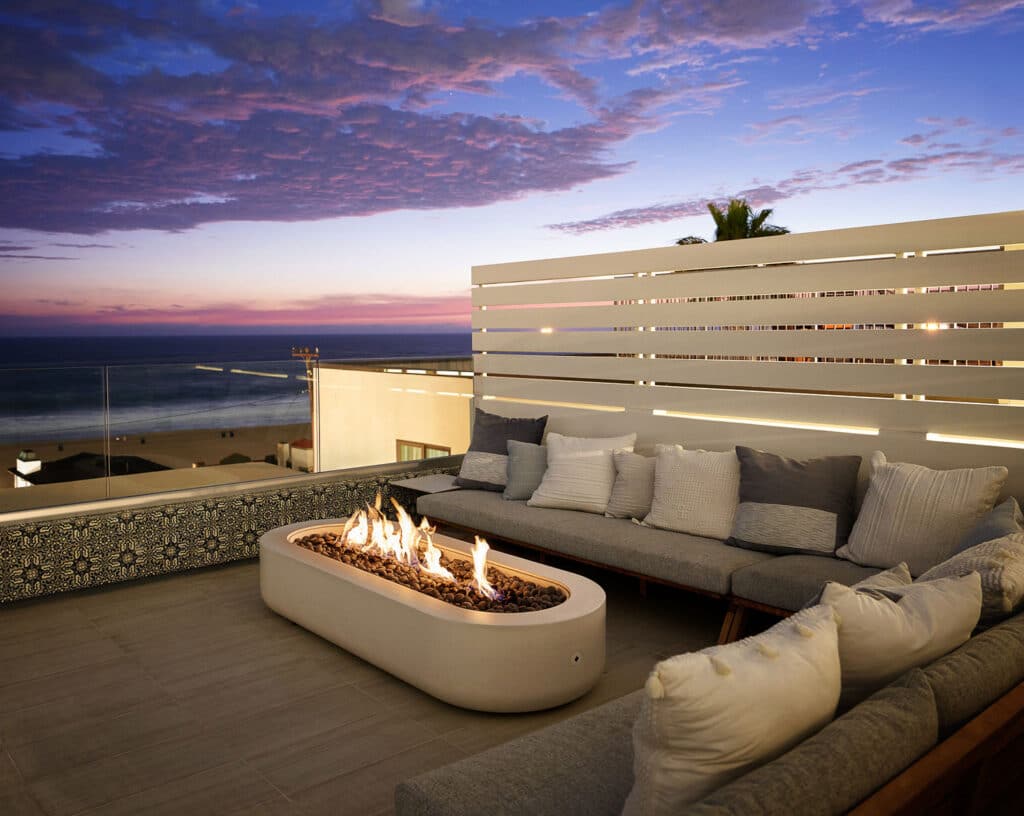 Rooftop outdoor fireplace on custom home built bo RJ Smith Construction